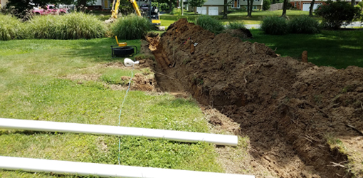 trenching yard sewer pipe